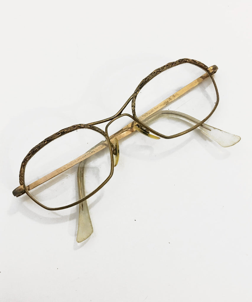 Thin frame sales gold glasses